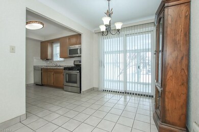 Dinette with sliding doors to the enclosed porch.