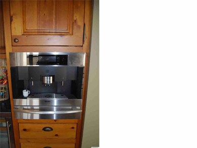Like to wake up to a nice cuppa? Miele built in coffee maker ( hot water for tea or hot chocolate).Warming drawer that accommodates both cups and mugs. Wine fridge is below the black granite counter, Both are within reach of the breakfast nook.