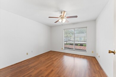 Bright and airy room with laminate floors, a ceili