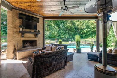 Designer finishes extend to your outdoor spaces. The floor is exquisitely tiled and the ceiling features exposed wood planks and a ceiling fan. Your surround sound system continues outdoors. Or, put on the Titans & Preds games with multiple TV Mounts