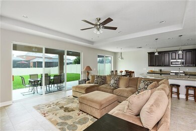 WIDE OPEN FAMILY ROOM WITH LOADS OF NATURAL LIGHT