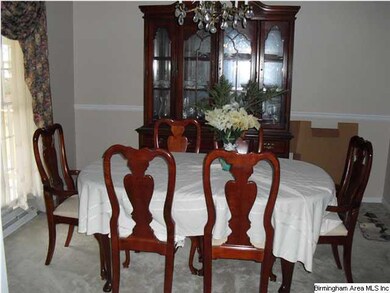 Large formal dining room adjacent to living room a