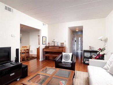 Living room opens to the dining room.