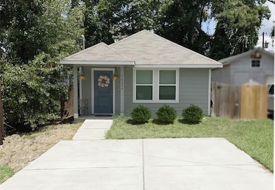 Front of home . Double wide parking pad.