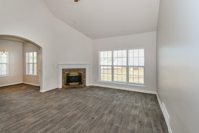 Unfurnished living room featuring visible vents, b