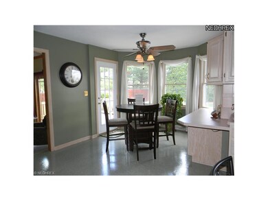 Sunny dinette area features a door to the deck and
