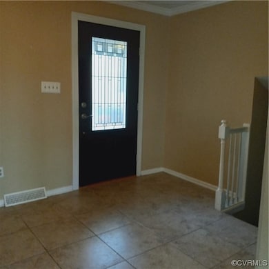 Doorway to outside featuring light tile floors