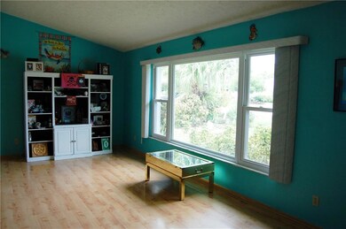 The living room opens to the casual dining area of