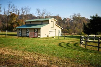 3 STALL LOFT BARN  complete with wash bay and a riding corral lighted  and 3 miles of private trails for hiking  or riding and 1.3 miles of Prime Mitchell River Frontage great for fly fishing and Kayaking