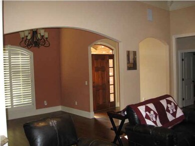 Arches in living, formal dining, foyer