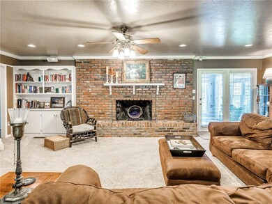 Living Space with fireplace. Doors lead out to tru