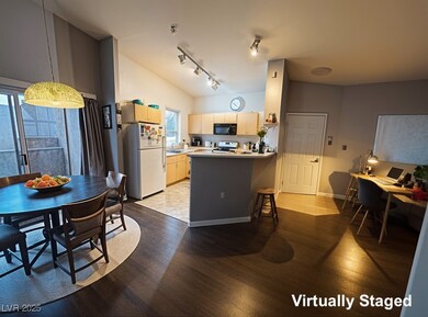 Kitchen with black microwave, freestanding refrige
