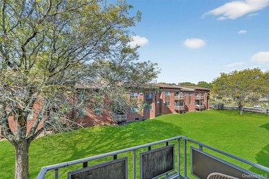 Balcony overlooks private common area in the rear of building.