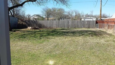 Fenced backyard - storage building in back also