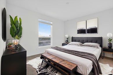 Carpeted bedroom with baseboards