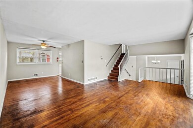 Unfurnished living room with hardwood / wood-style