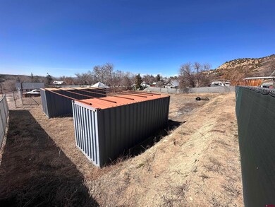 View of yard with a mountain view and fence