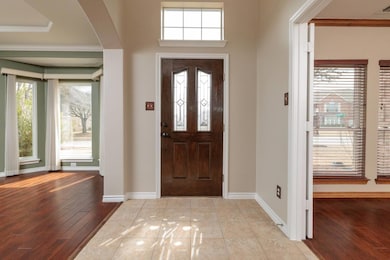 Entrance foyer with arched walkways, visible vents