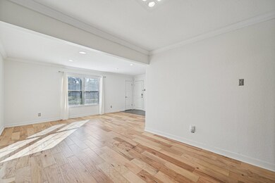Spare room with light wood-type flooring, baseboar