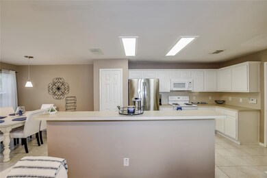 Kitchen with pantry, electric range,
island with