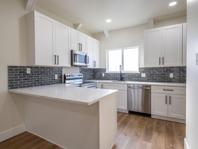 Kitchen featuring appliances with stainless steel