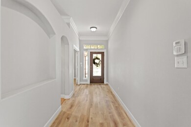 Welcoming wood/glass door, tall ceilings