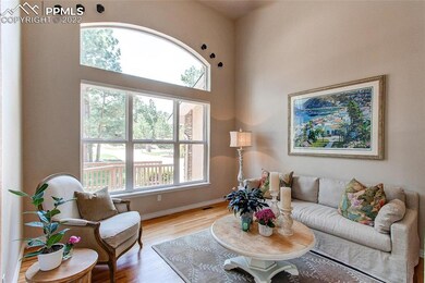 Formal living room features neutral colors, hardwo
