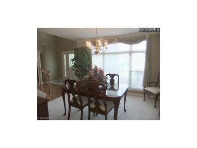 The dining room is located to the left of the foye