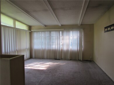 Living Room has the classic beamed ceiling of this