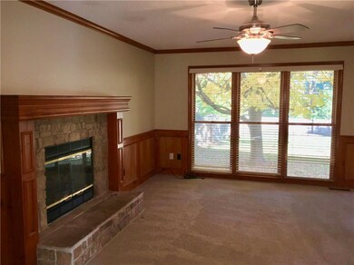 Large windows overlook the spacious back yard!