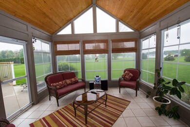 Bright and inviting 3 season room.