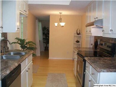 UPDATED KITCHEN WITH NEW COUNTERTOPS HARDWARE AND 