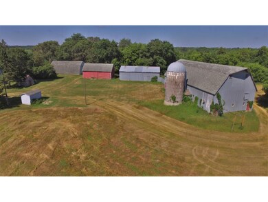 A view of the other outbuildings and pole shed on 