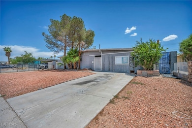 Single story home with concrete driveway