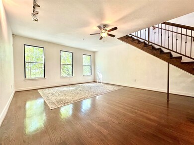 Spacious living area with windows overlooking onto