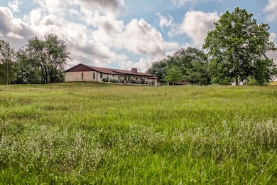 View of yard with a rural view