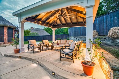 This custom pool cabana with ceiling fan is the perfect spot to cool off and enjoy a cold beverage after a long day!