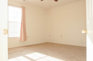 Unfurnished room with light colored carpet and cei