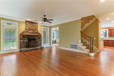 Gorgeous Living Room with Stone Fireplace