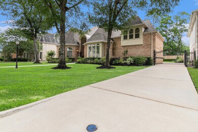 The property features a spacious driveway leading
