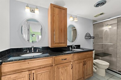 His and hers sinks with a walk-in shower.