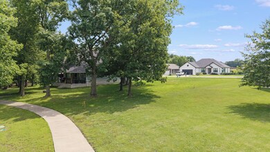Back of lot with walking trail