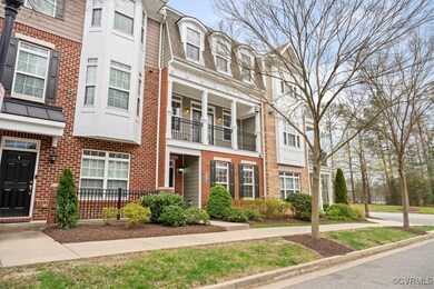 View of property with brick siding