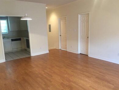 Unfurnished living room featuring light wood fini