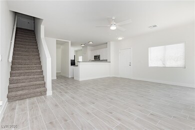 Unfurnished living room with a ceiling fan, light