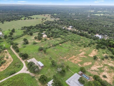 Overview of rural landscape featuring a heavily w