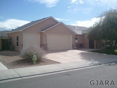 3 car garage, fenced back yard, and nicely landsca