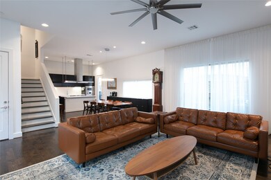 Tall ceilings and tons of windows puts an elegant touch on this beautiful living room.