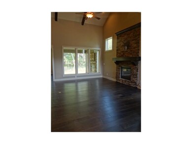 Great Room With Hardwoods and Stone Fireplace