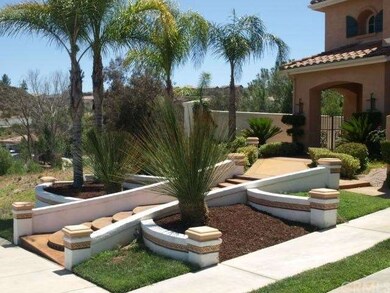 Lush landscape softens the custom hardscape and pr